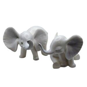 Pair Vintage White Porcelain Elephants Signed Tony Sitting & Standing Trunk Up